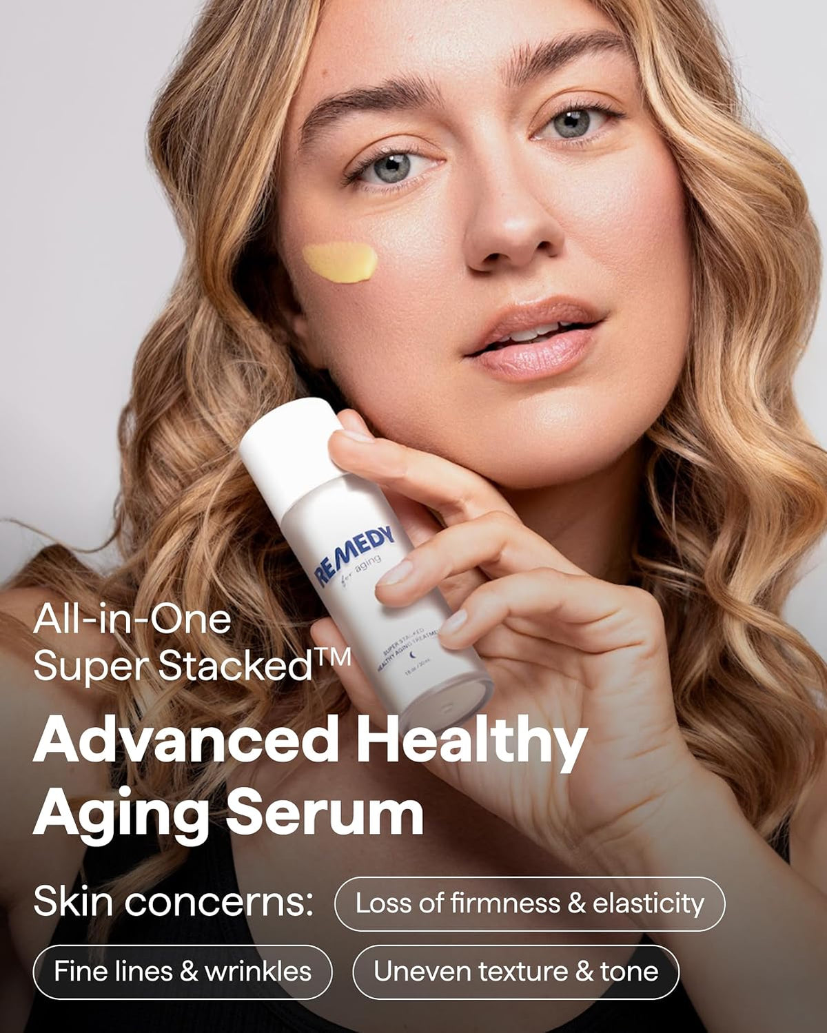 Remedy serum bottle held near face with yellow spot on cheek