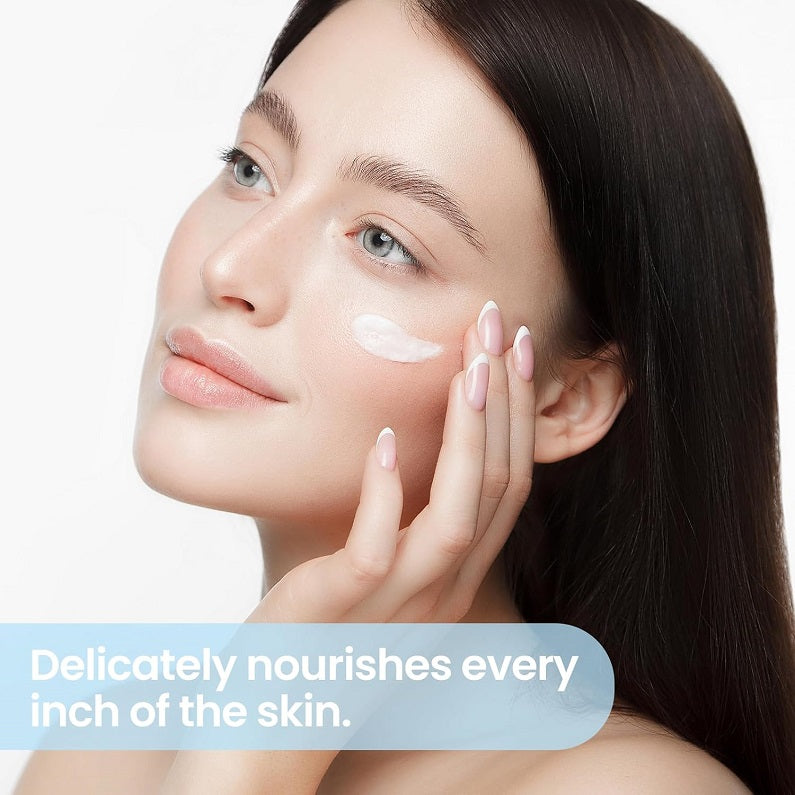 Woman applying bleaching cream to cheek with visible white cream