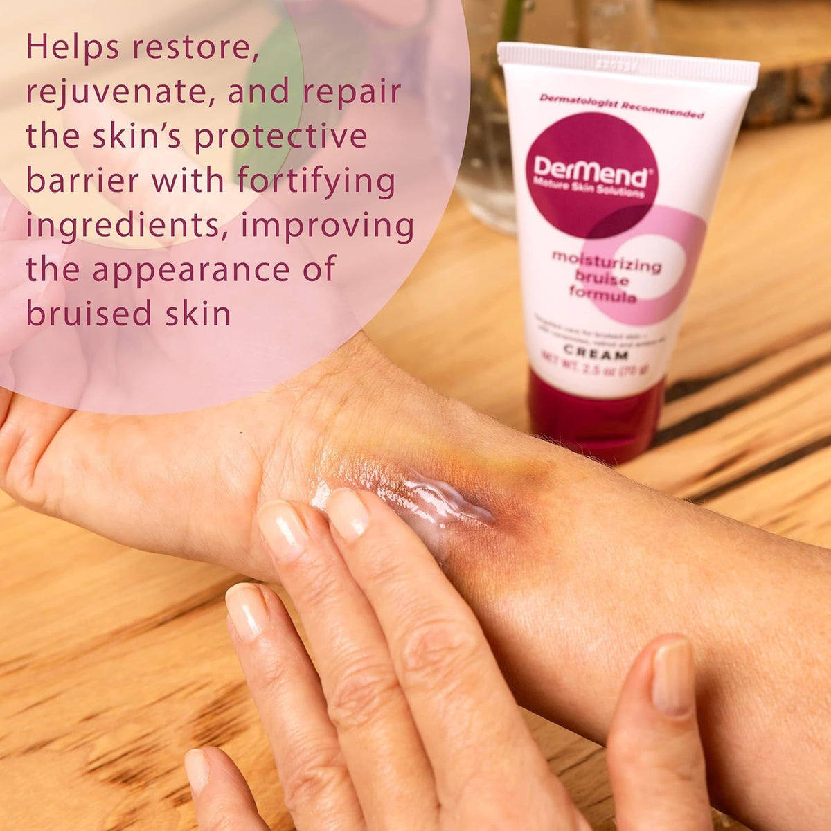 Moisturizing bruise formula cream tube held near forearm, white with pink