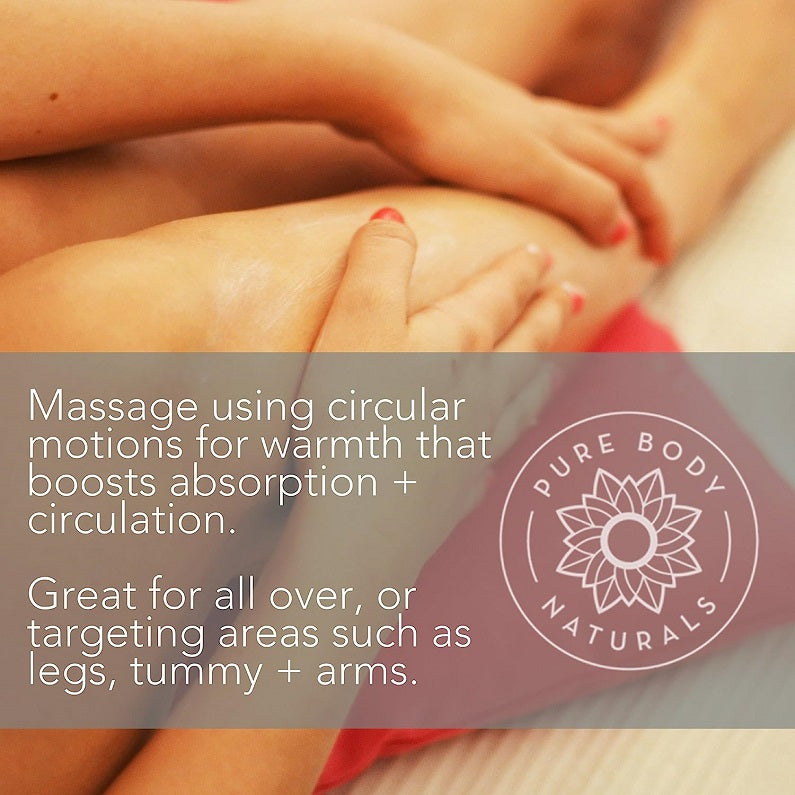 Hands massaging skin with oil, warm amber massage close-up