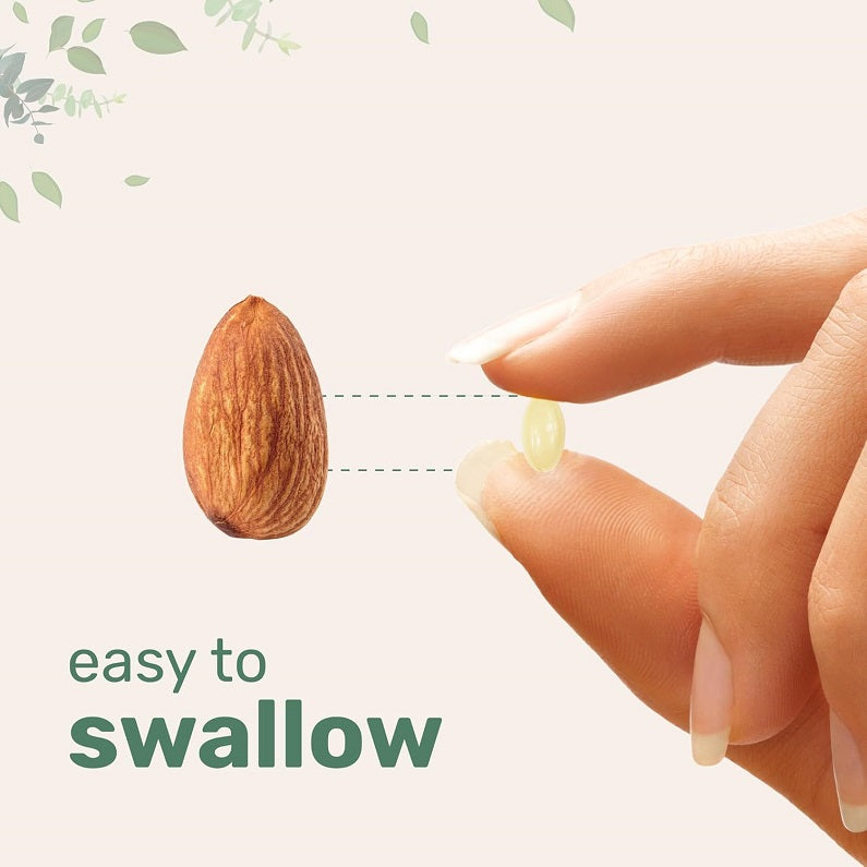 Vitamin D3 and K2 softgel held between fingers, small yellow capsule