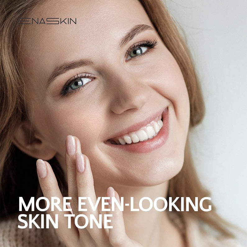 Smiling woman holding hands near face after applying serum for even-looking skin tone