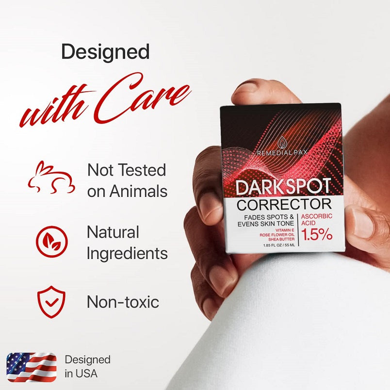 Dark spot corrector box in hand with “designed with care” icons for natural ingredients