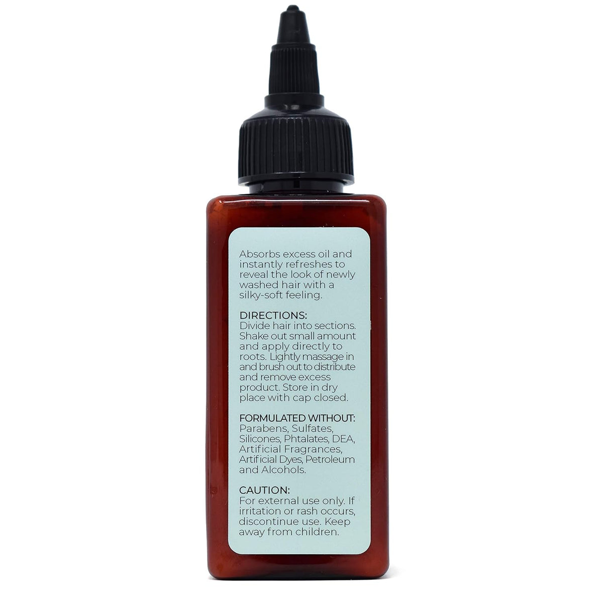 Amber dry shampoo bottle with black dropper cap, directions label visible