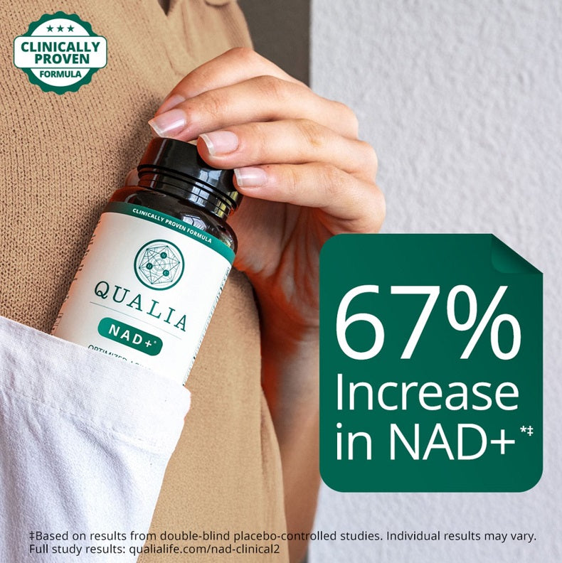 NAD+ supplement bottle held in hand, dark cap and teal label