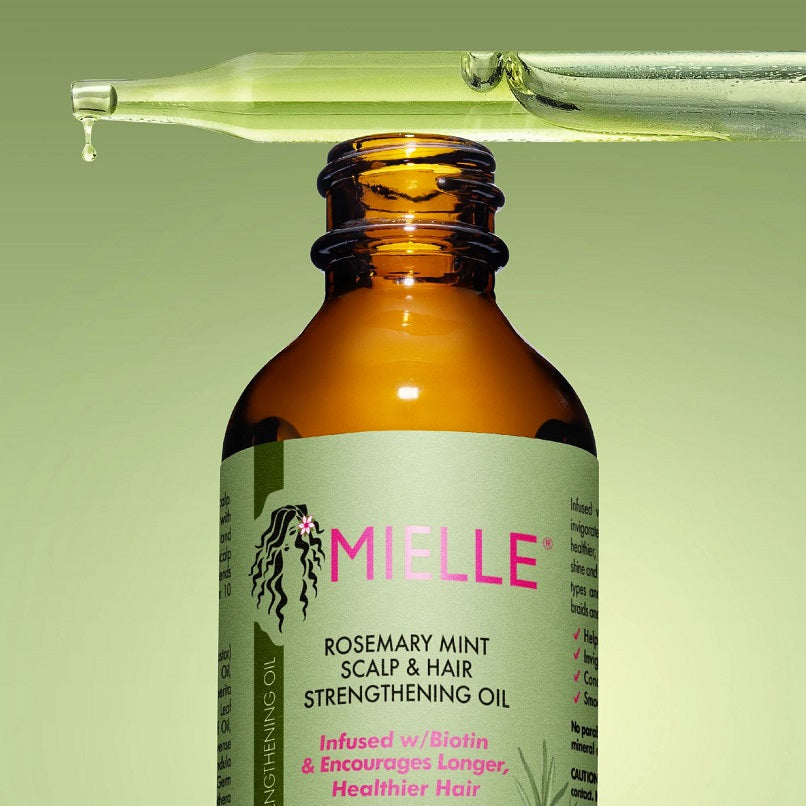 Mielle rosemary mint scalp oil, close-up label on amber bottle with black dropper
