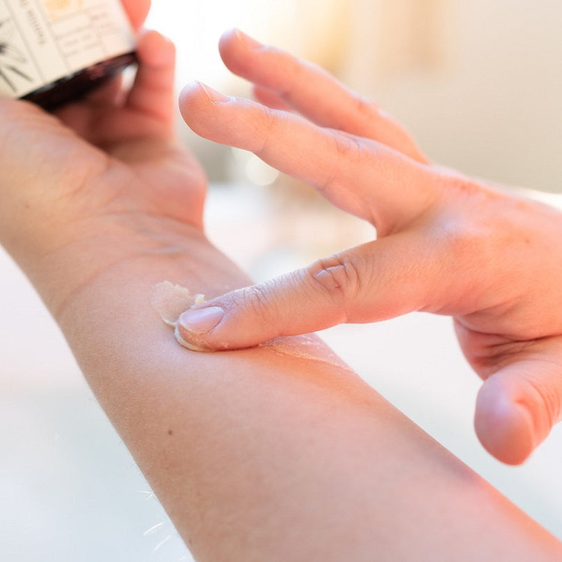 Whipped tallow balm dollop spread on hands, smooth moisturizer on skin