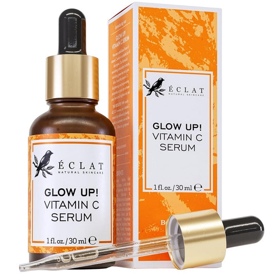 Vitamin C face serum bottle with gold pump and product box