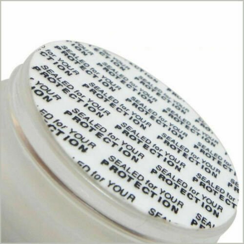Close-up of DHT blocker capsule bottle cap with printed label text