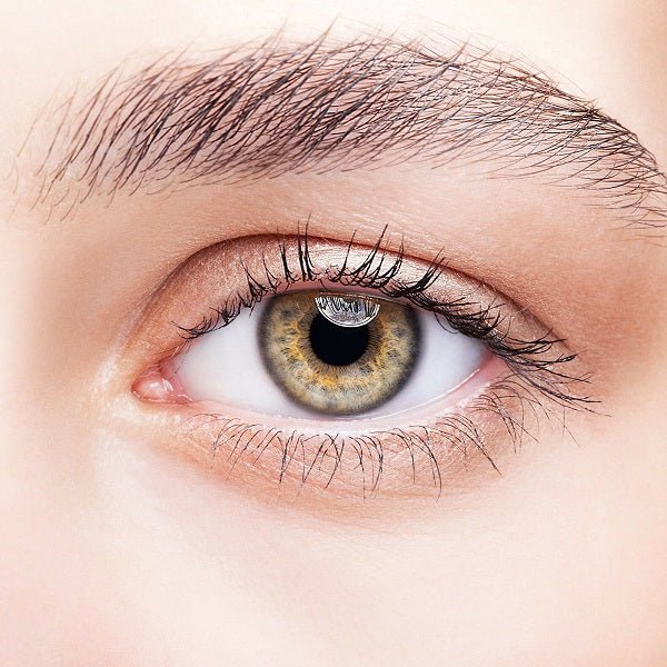 Close-up of a single eye with detailed lashes and greenish-brown iris