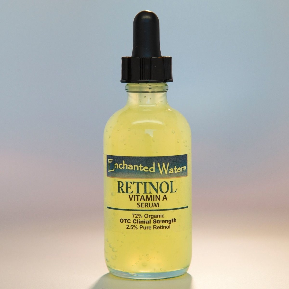 Retinol Vitamin A serum bottle with black dropper; yellow liquid; label says Retinol