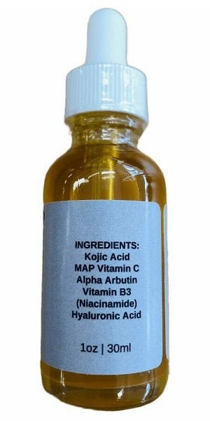 Skin whitening serum bottle with blue cap and ingredients label, amber glass.