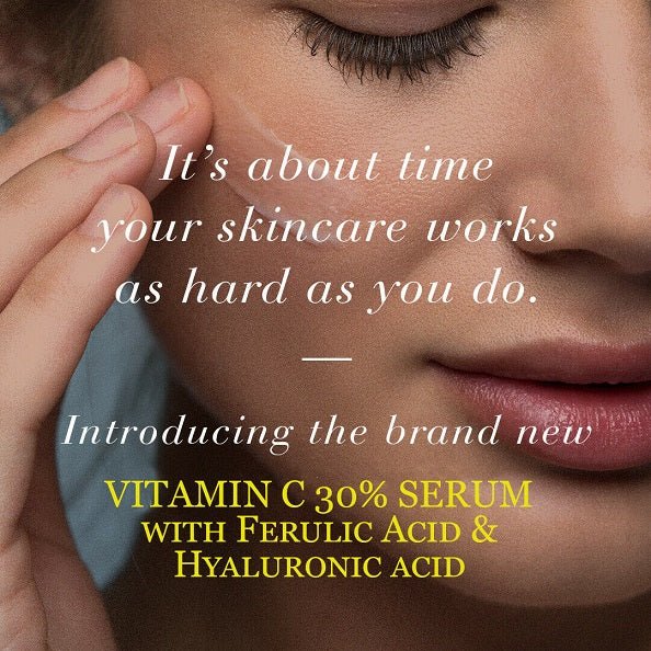 Woman applying Vitamin C serum near eye and cheek