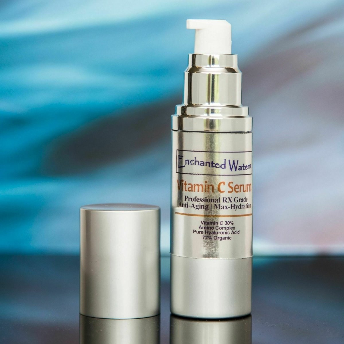 Vitamin C serum bottle with pump beside matching travel-size jar