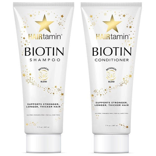 Biotin shampoo and conditioner tubes, white with gold star accents