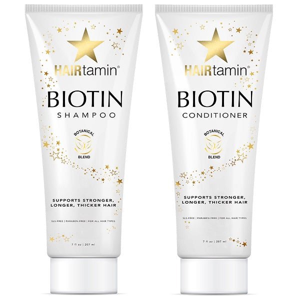Biotin shampoo and conditioner tubes, white with gold star accents