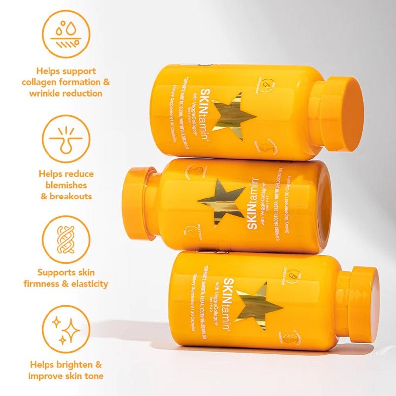 Three orange SKINtamin supplement bottles with star labels and benefit icons