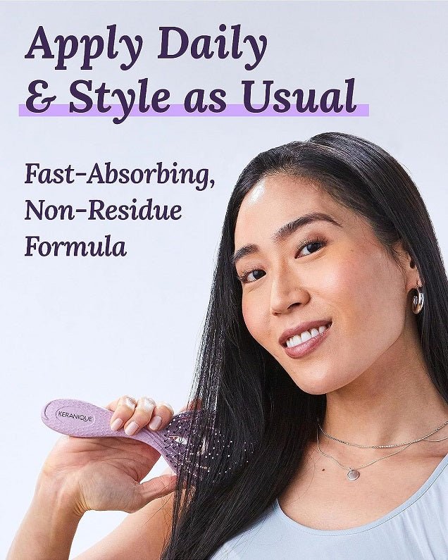 Keranique follicle boosting serum bottle in woman’s hand, smooth dark hair