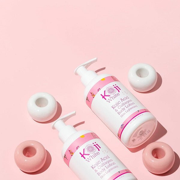 Two white pump bottles with pink caps and pastel circular bases
