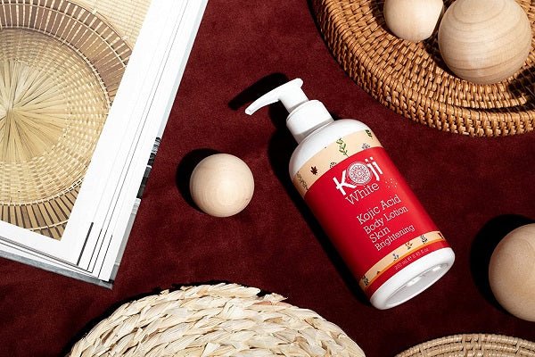 Koji White kojic acid body lotion bottle with pump and red label