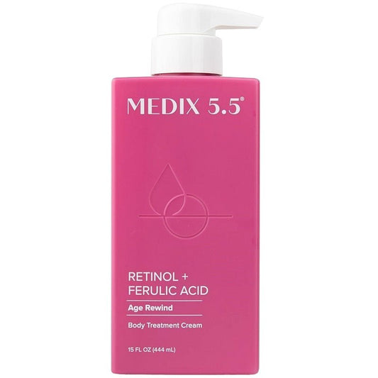 Pink retinol + ferulic acid body cream bottle with a white pump dispenser.