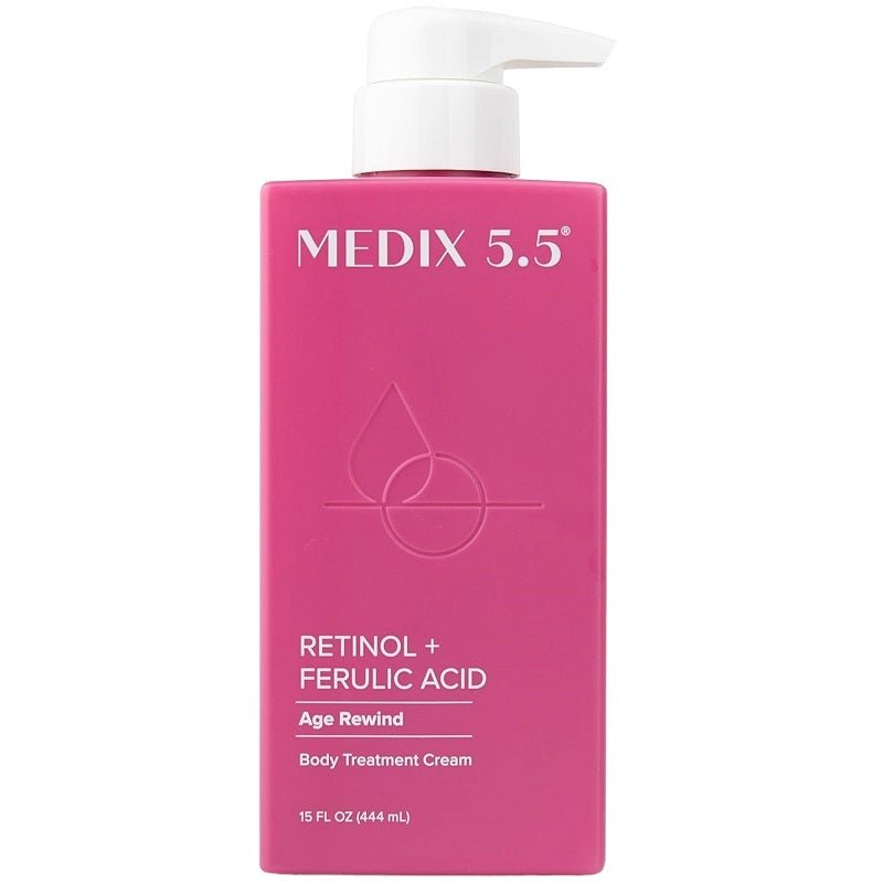 Pink retinol + ferulic acid body cream bottle with a white pump dispenser.