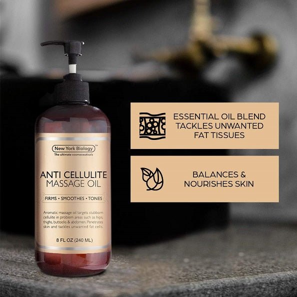 Anti-cellulite massage oil bottle on stone surface with black pump, New York Biology