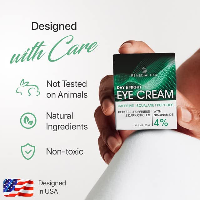 Hand holding day and night eye cream box with animal-test and care icons