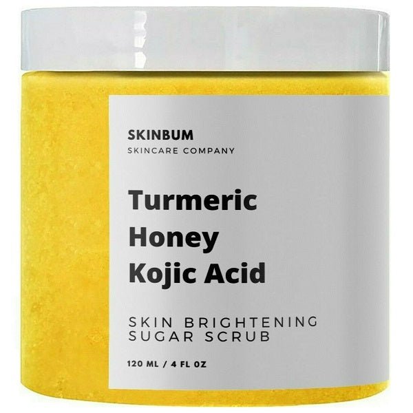 Turmeric honey kojic acid sugar scrub jar with visible yellow sugar texture