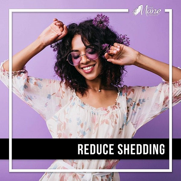 Woman with curly hair smiling, hands in hair; reduce shedding text overlay