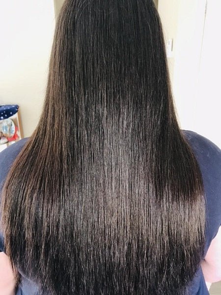 Straight dark hair close-up, smooth glossy strands to mid-back