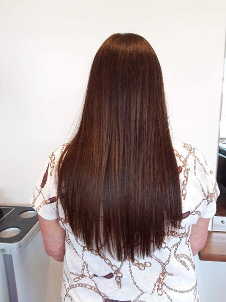 Long straight dark brown hair from the back view