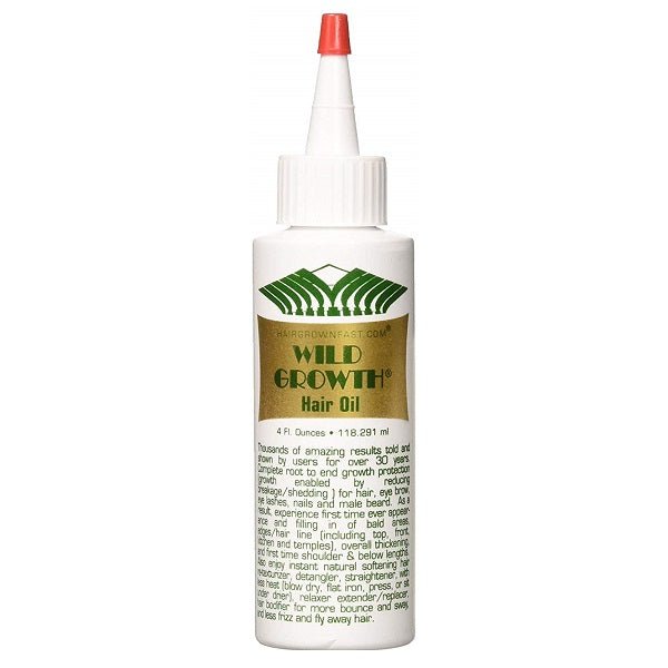 White hair oil bottle with red cap, green leaf logo label